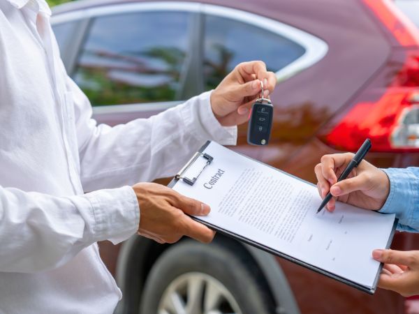 Person signing a Car Rental agreement